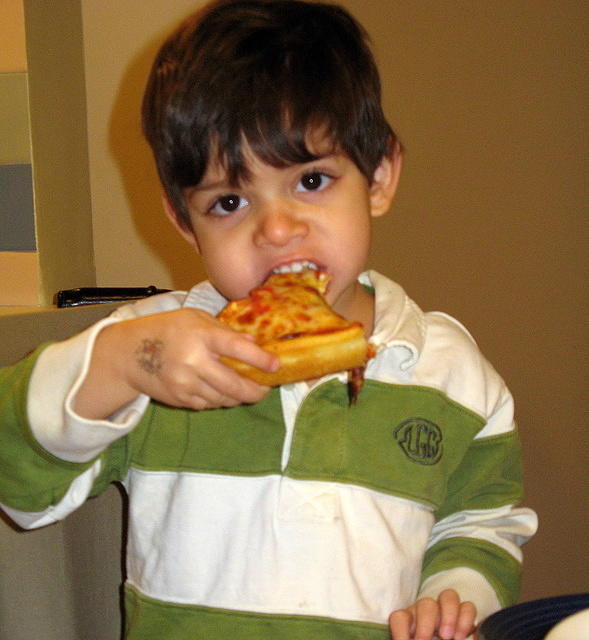 Back home, eating pizza "like a big boy"