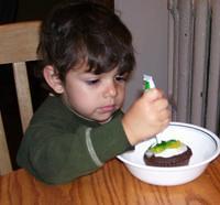 Helping decorate the cupcakes