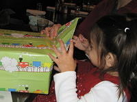 Opening an early present from great-grandma